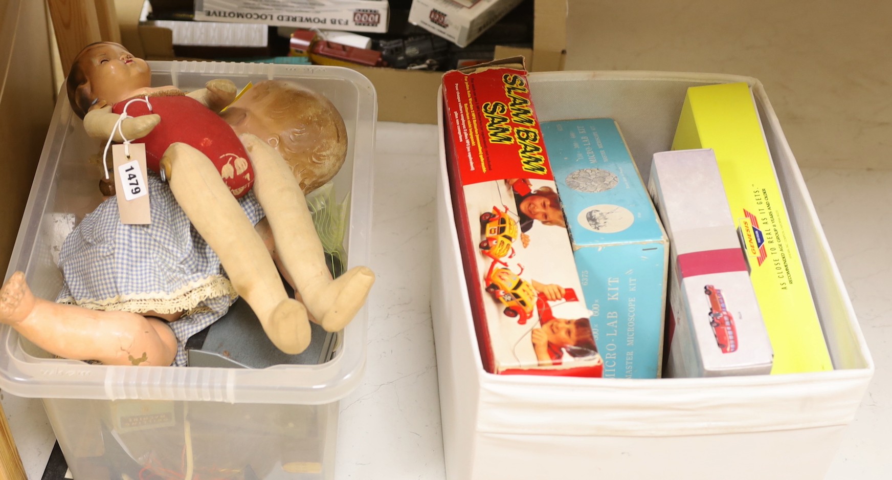 An assortment of miscellaneous boxed toys, two dolls etc
